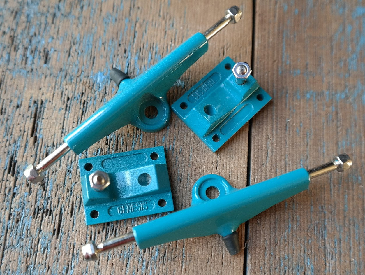 Teal Genesis Trucks with LevelUp Bushings