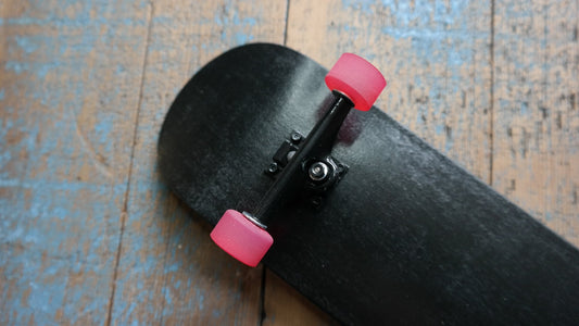 The All Black with Pink Wheels